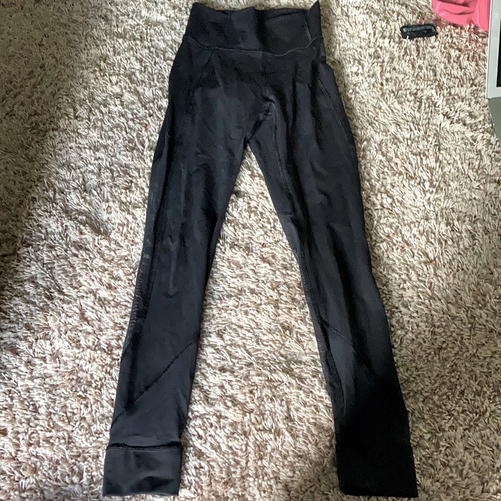 Black Lululemon leggings with mesh on the side